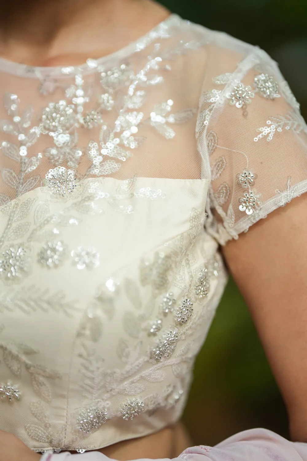 White Net Blouse with Sheer Yoke and ShimmeringFloral Design Sequins